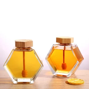 Šestihranná stylová skleněná láhev na med s míchací tyčinkou | 220 ml
